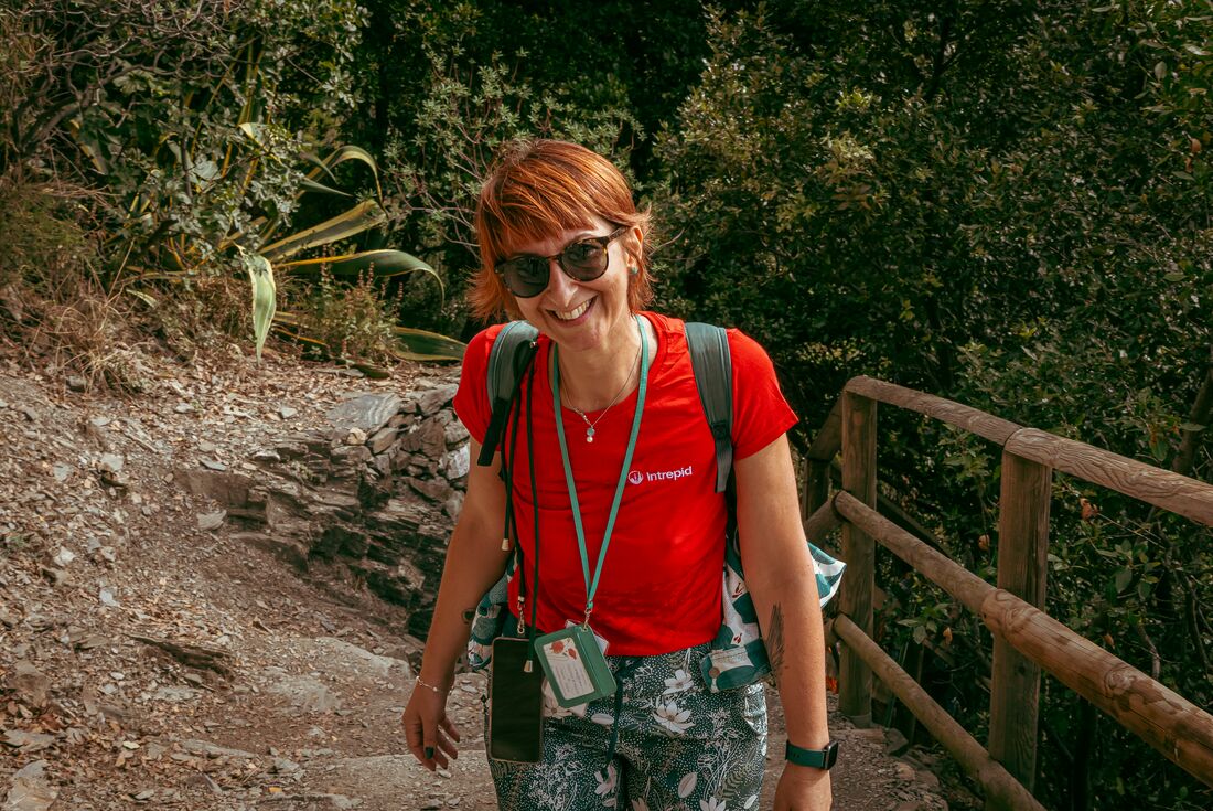 Leader smiling at camera while on a hike in Cinque Terre, Italy