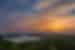Sunset over Yaxha-Nakum-Naranjo National Park seen from the pyramids