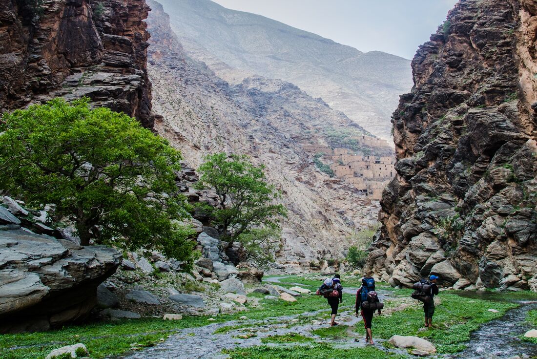 Walking along a creek bed in the High Atlas Mountains on the way to a mountainside village