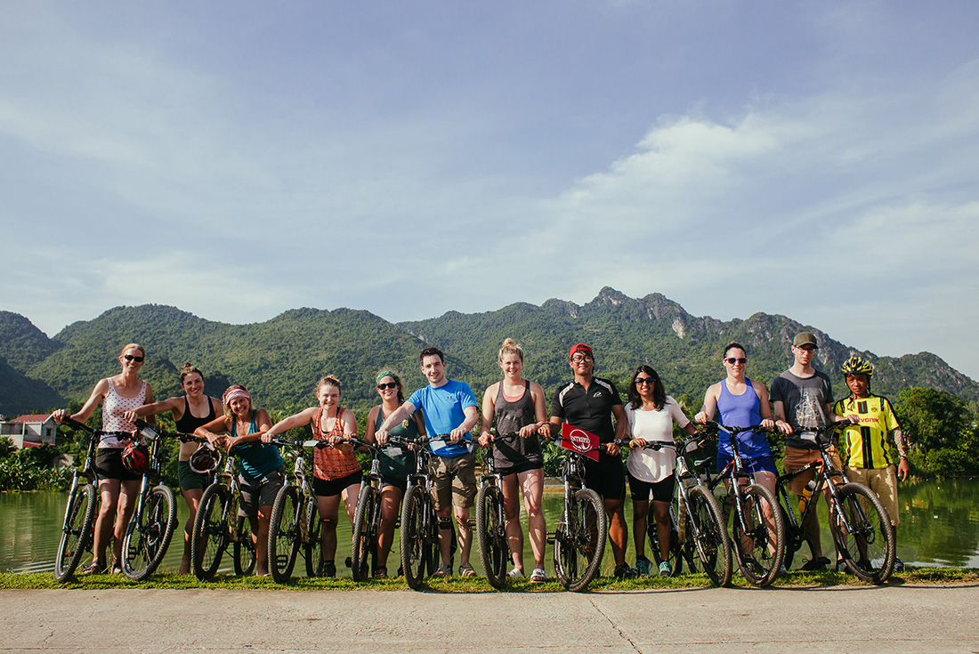 Group of travellers on an Intrepid Travel tour through the Vietnamese countryside.