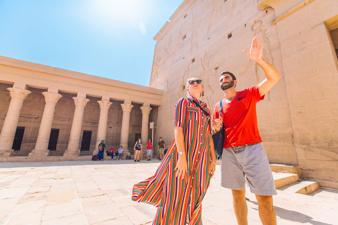 Travellers amongst the ruins of Aswan in Egypt