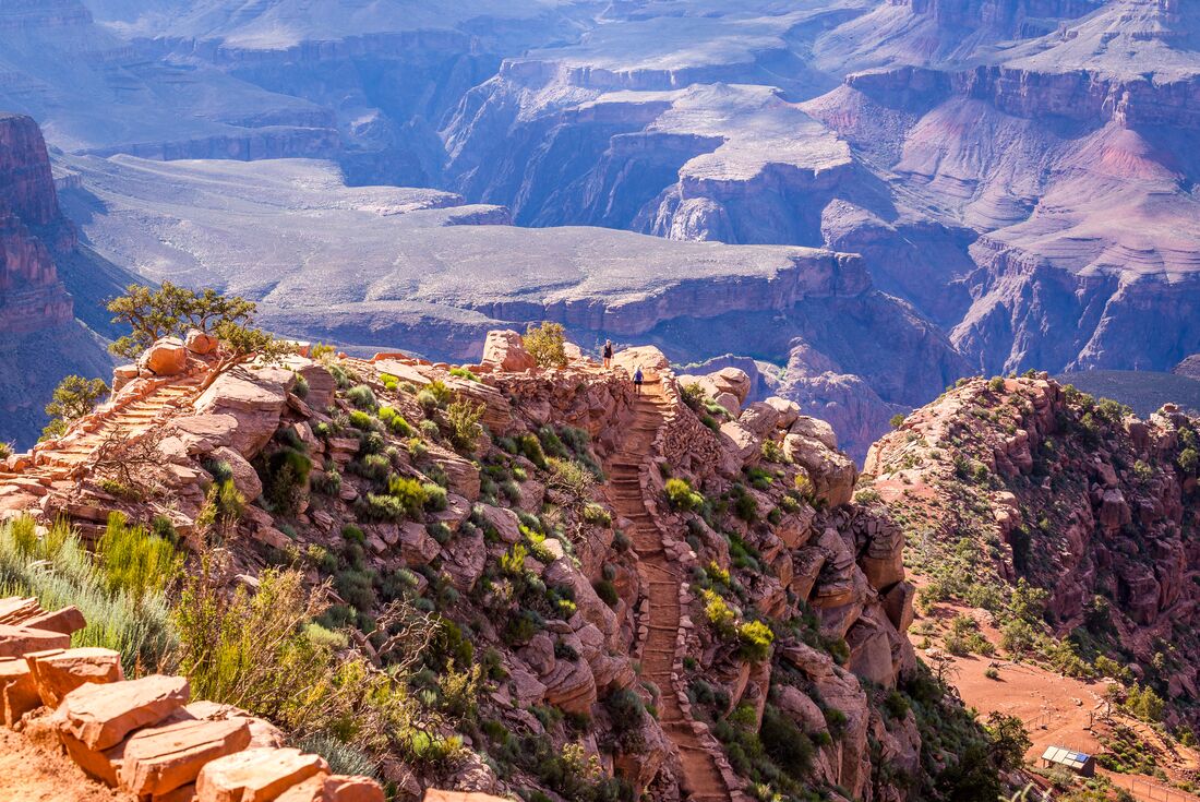 Traveller in the scale of the Grand Canyon, starting out on the Bright Angel Trail