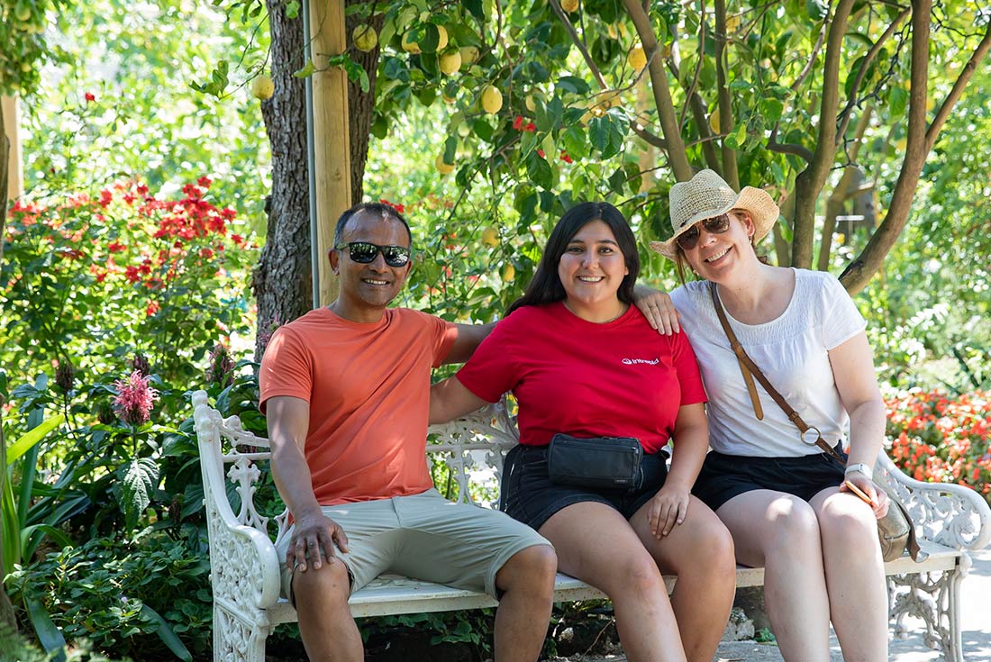 group sitting in a garden, Italy