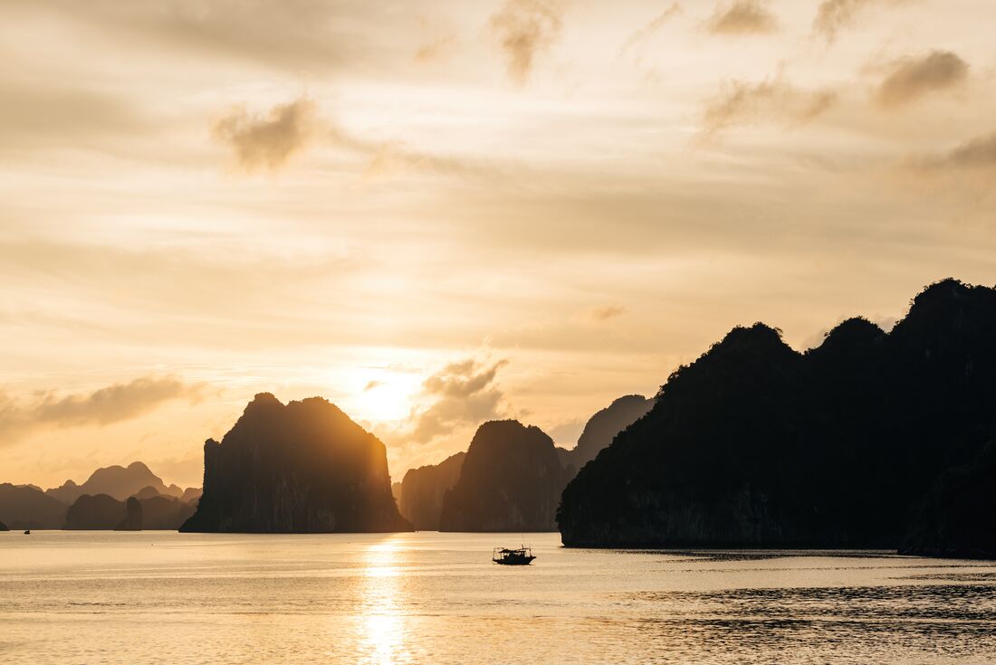 Sunrise on the mountains of Halong Bay afternoon an overnight cruise around its waters