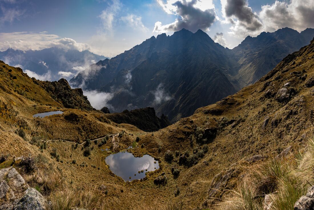 Passing a mirror pool between two ridges of the Andes on the Inca Trail
