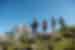Group of travellers descending a hill with various hiking gear in the Italian Dolomites